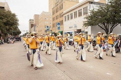 The World Famous Cowboy Band marching in a parade.