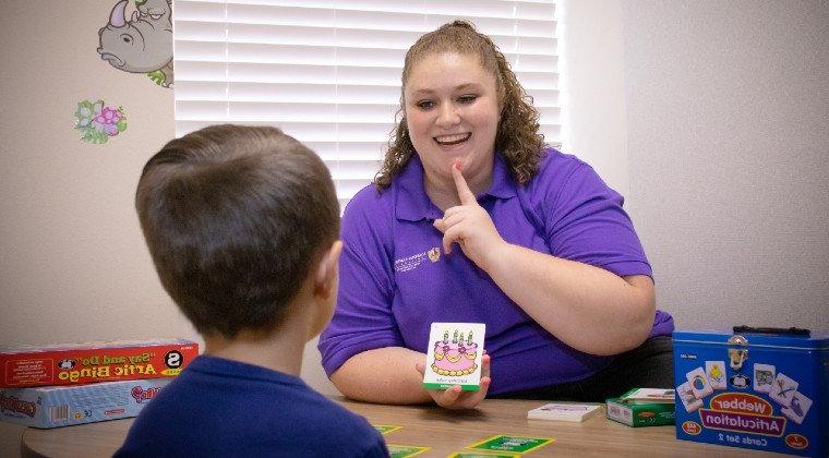 A speech pathologist works with a client at HSU's clinic.